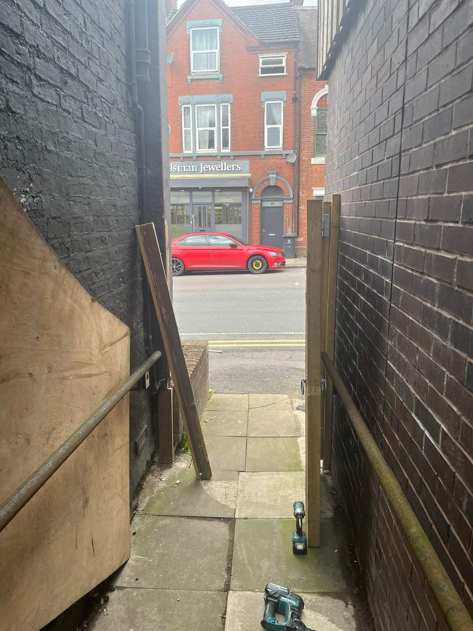 Before: broken gate post